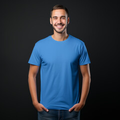 Wall Mural - Smiling men wearing blue T-Shirt Mockup on black studio background