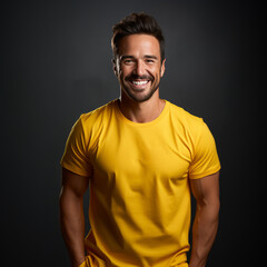 Wall Mural - Smiling men wearing yellow T-Shirt Mockup on black studio background