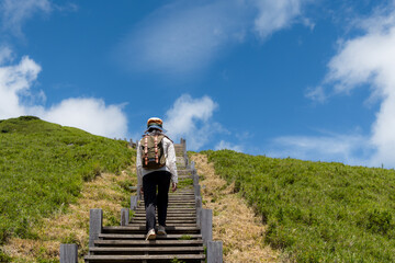 Poster - Travel woman walk along the hiking trail over the mountain