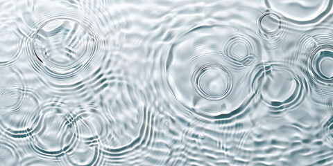 Poster - water droplets on a surface. Each droplet glistens with clarity, reflecting the surrounding light. The intricate patterns and shapes formed by the droplets add a unique texture to the surface