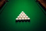 Fototapeta Sypialnia - Pyramid of billiard balls on a green canvas