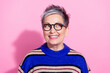 Leinwandbild Motiv Portrait of funky woman with short hairdo wear striped pullover in glasses look at promo empty space isolated on pink color background