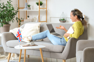 Sticker - Mature woman with laptop studying English online at home