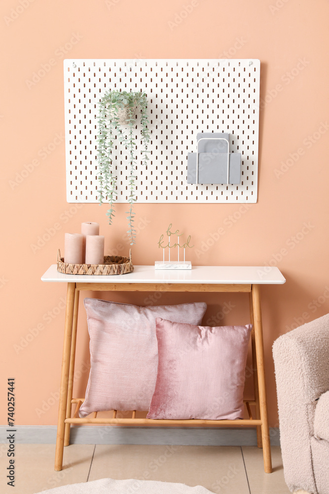 Interior of living room with table and pegboard
