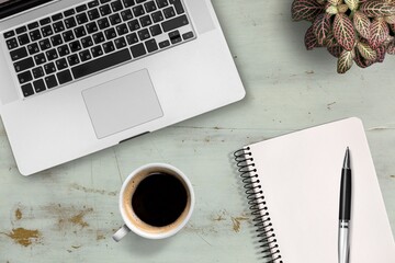 Poster - Wooden desk with laptop, notebook and cup of coffee