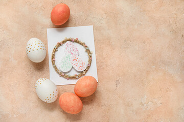 Poster - Painted Easter eggs with wreath and card on beige grunge background