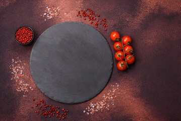 Wall Mural - Empty ceramic round plate on dark textured concrete background