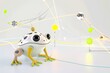 A frog in minimal computer cgi environment, showing a contrast between nature and technology. The frog seems curious as it examines the intricate details on the chip.
