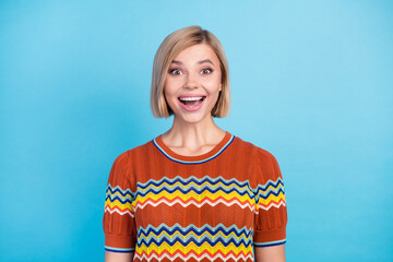 Poster - Photo of impressed pretty woman with bob hairdo dressed knit t-shirt staring at unbelievable sale isolated on blue color background