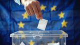 Fototapeta Mapy - Man throwing his vote into the ballot box. Elections to the European Parliament