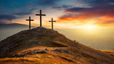 Fototapeta  - Three crosses on hill at sunset, symbolizing Crucifixion of Jesus Christ. Religious concept with space for caption