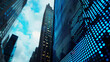 © Studio Nova - a close-up, upward perspective of towering skyscrapers with a digital, LED-lighted building facade against a backdrop of a clear blue sky with clouds.