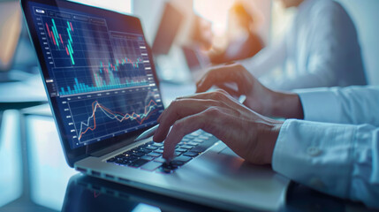 Sticker - An individual is analyzing financial charts and graphs on a laptop screen in an office setting.