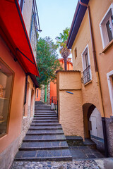 Canvas Print - Narrow street among medival houses in old Gandria village, Switzerland