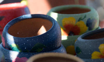 Wall Mural - Stack of Mexican ceramic pots, blue and grey painted floral patterns