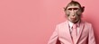 © Andrei - Anthropomorphic monkey in business suit working in corporate studio, plain wall with text space.