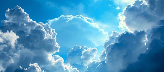 Wall Mural - A heartshaped cumulus cloud in the electric blue sky with the sun shining through, a beautiful meteorological phenomenon in the natural landscape