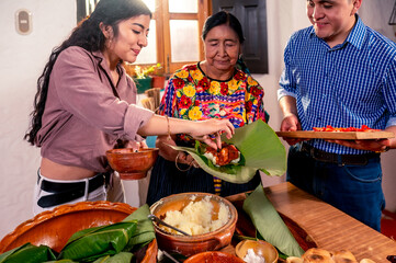 Wall Mural - Latin family prepares food for a holiday.