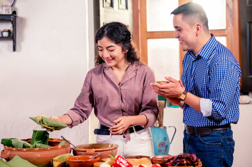 Wall Mural - Latin friends prepare Christmas dinner.