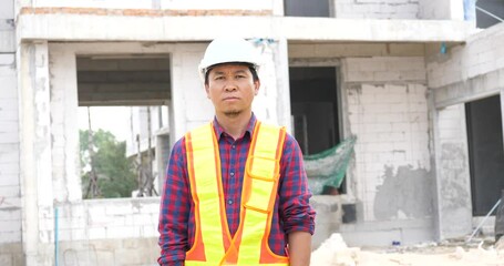 Canvas Print - Serious-looking, stressed worker at construction site