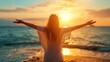 © Adriana - Backlit Portrait of calm happy smiling free woman with open arms and closed eyes enjoys a beautiful moment life on the seashore at sunset