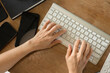 © littlepigpower - Female hands typing on a computer keyboard