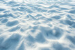 © ebhanu - Beautiful Winter Background with Snowy Ground: Natural Snow Texture with Wind-Sculpted Patterns on the Snow Surface.
