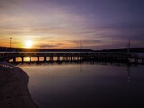 Fototapeta Londyn - Sunset at the pier. Lake Ukiel. Poland