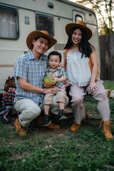 happy harmonious Asian family outdoors concept, Asian mother and son have activities happy fun together on holidays, grass land with sunlight