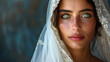 Portrait of a beautiful with green eyes bride in a veil on a dark blue background, wedding dresses concept