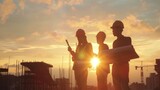 Fototapeta Nowy Jork - Silhouette of engineers in construction site, sunset in background