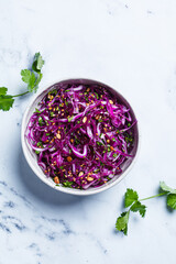 Poster - Purple coleslaw salad with cilantro and nuts.