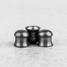 Lead Bullets For Pneumatic Weapons On A Gray Background Closeup, Black White Photo