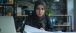© orendesain99 - Portrait of muslim businesswoman wearing hijab work on modern office. AI generated image