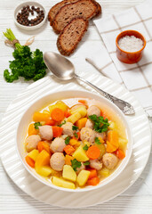 Poster - finnish sausage soup with vegetables in white bowl