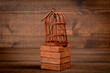 Rusty bird cage on wood texture background. Captivity, prison and the concept of repression