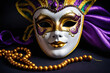 Venetian carnival mask and beads decoration. Mardi gras background