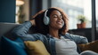 © YauheniyaA - Close up of calm young woman in wireless headphones relax on sofa at home dream listen to music, peaceful millennial girl in earphones rest on couch take nap sleep enjoy good quality sound in headset