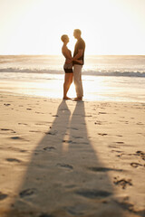 Poster - Man, woman and hug at beach for sunset for holiday happiness together, honeymoon or marriage. Couple, evening and embrace for commitment or Miami weekend for love travel, vacation or relationship