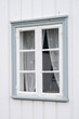 And old window on a scandinavian house with lovely curtains