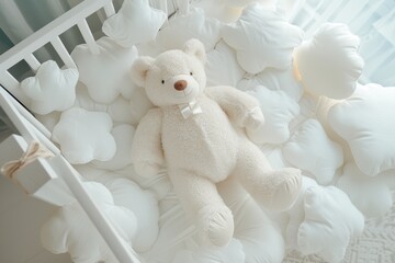 Poster - Top view of a newborn s white crib with toy bear clouds shaped pillows and a baby romper