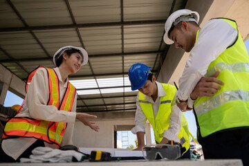 Wall Mural - Construction concept of Engineer or architect meeting for project working with partner and engineering tools on building and blueprint in working site