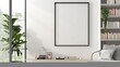 A mockup poster blank frame hanging on a bright white wall, above a contemporary floating bookshelf, Minimalist-style living area