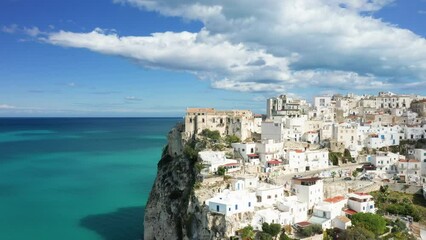 Sticker - The medieval town center of Peschici on its steep cliff in Europe, Italy, Puglia, towards Foggia, in summer, on a sunny day.