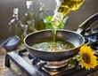 Sonnenblumenöl in Pfanne gießen - Kochen und backen