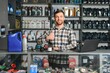 © Serhii - A salesman in an auto parts store. Retail trade of auto parts