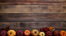A Group Of Pumpkins With Dried Autumn Leaves And Twigs, On A Maroon Color Wood Boards