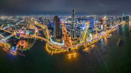 Wall Mural - Top view aerial photo from flying drone of a Ho Chi Minh City with development buildings, transportation, energy power infrastructure. Financial and business centers in developed Vietnam.