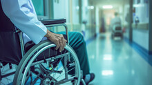 Asian Senior Patient On Wheelchair In Hospital Corridor. Healthcare And Medical Concept .