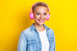 Photo portrait of attractive young woman headphones listen music dressed stylish denim clothes isolated on yellow color background